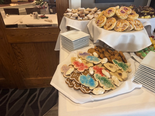 A table filled with a variety of cookies.
