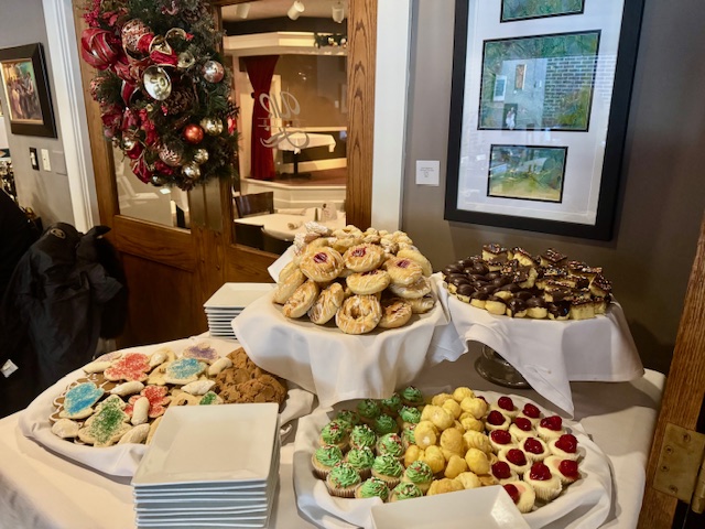 A table filled with a variety of cookies.